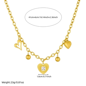 Collier en acier inoxydable doré avec pendentif cœur et boule serti de cristaux