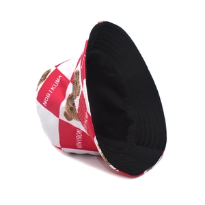 Red plaid reversible bucket hat featuring cute bear print and black inner fabric lining