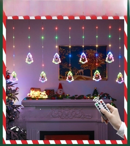 Christmas LED curtain lights with remote control shown in cozy home fireplace setting