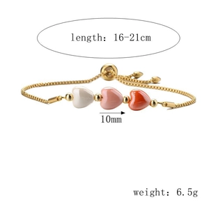 Detail view of 16-21cm adjustable gold bracelet with white pink and red heart beads
