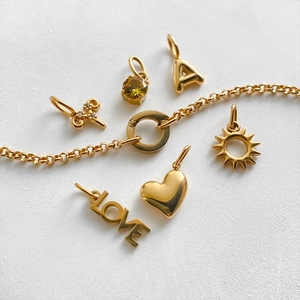 Exquisite 14K gold plated stainless steel bracelet featuring heart, sun, and LOVE charms
