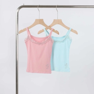 Detail of pink and blue ribbed camisoles with lace trim and rhinestone logo accents