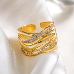 Macro shot of 18K gold plated multi-layer geometric ring with sparkling zircon inlays
