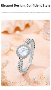 Close-up of silver leaf-shaped bracelet watch with crystals and mother of pearl dial