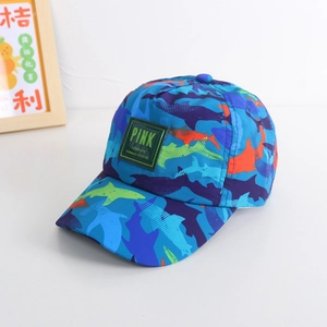 Detailed close-up of kids baseball cap with shark camouflage print and green patch