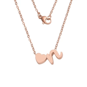 Detail of rose gold heart pendant with lowercase letter n and lobster clasp on fine chain