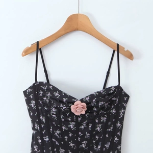 French vintage floral puff dress in black with lavender flowers and a 3D bust flower detail