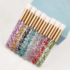 Portable eyelash cleaning brushes with glitter handles and soft white bristles in various colors