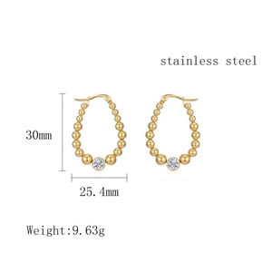 Detail view of gold beaded stainless steel earrings with oval cz stone and dimensions