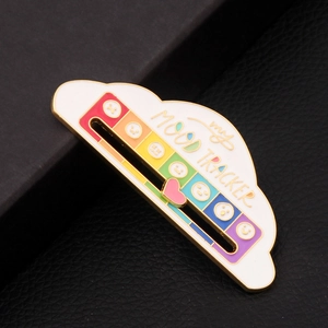 Macro view of my MOOD TRACKER cloud pin with sliding heart and rainbow enamel scale