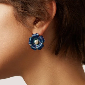 Vintage gold-rimmed blue flower stud earrings with center pearl for elegant women