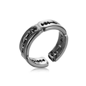 Macro shot of gunmetal blade-shaped adjustable open ring with metallic texture