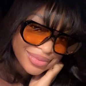 Retro oversized irregular double bridge sunglasses with black frame and orange lenses