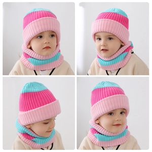 Close-up of pink and green striped knitted hat and neck warmer set for children