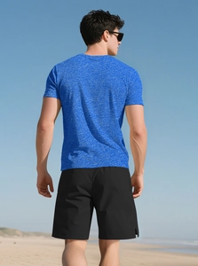 Outdoor shot of men's blue textured gym t-shirt and black sports shorts from the back