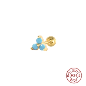 Macro shot of 925 silver flower stud earring with blue stones and screw ball back
