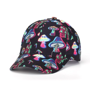 Detail of black baseball cap with vibrant colorful cartoon mushroom print on fabric