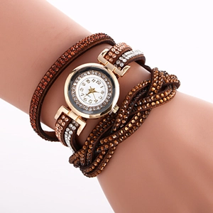 Close-up of a women's quartz watch with brown braided strap and sparkling orange crystals