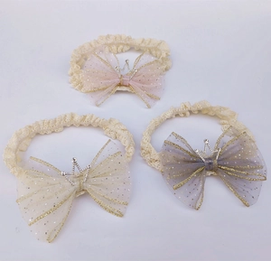 Three-pack of baby headbands featuring lace bows and small crowns in pink beige and grey