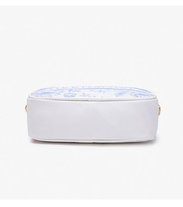 Detail of white lychee leather handbag base with blue floral patterns and gold hardware