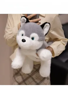 Close-up of husky plush toy with realistic grey fur and expressive blue eyes