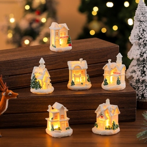 Set of 6 glowing white resin Christmas village houses with warm LED lights and snowy details