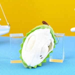 Close-up of soft green and white durian plush keychain with metal ring.
