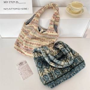 Detail of plush tote bags with colorful patterns and magnetic snap button closure