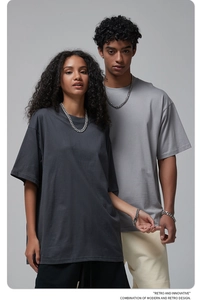 Detail of drop shoulder oversized cotton t-shirts with heavy fabric texture and chains