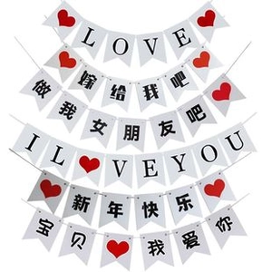 Detail of assorted wedding and proposal banners with heart designs and red lettering