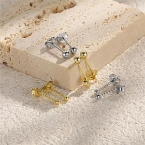 Detailed view of S925 sterling silver ball studs in gold and silver mirror finish