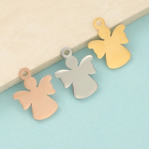 Detail of mirror-polished angel girl charms in rose gold, silver, and gold steel