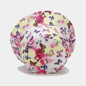 Detail of yellow and pink tie-dye sun hat featuring vibrant butterfly prints and stitching