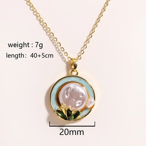 Detail of flower pendant necklace with natural freshwater pearl and green enamel accents