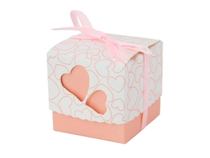 Detailed view of a pink paper gift box featuring double heart cutouts and a pink silk ribbon
