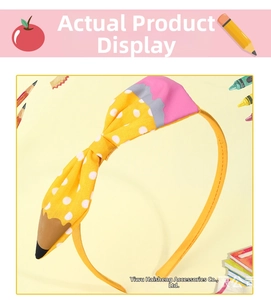 Detailed view of yellow pencil-themed bow headband with polka dots for school children