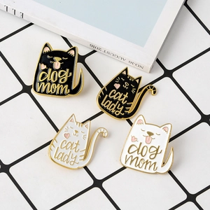 Detail of four enamel pins with cat designs and 'Dog Mom' and 'Cat Lady' lettering