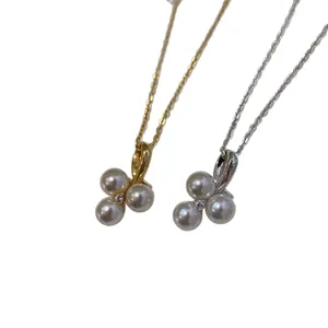 Three-petal pearl pendant necklace with zircon accent in gold and silver finish options