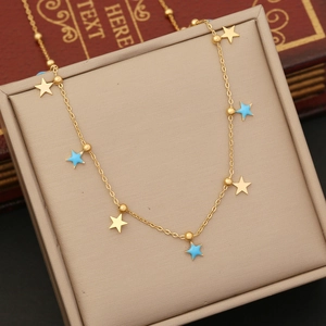 Gold stainless steel necklace with blue enamel star pendants and small beaded accents