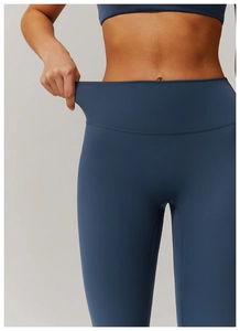 Close-up of high-elasticity fabric on high-waist yoga pants showing stretch performance