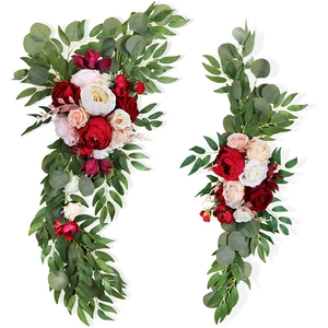 Close-up of artificial rose and maple leaf garland with realistic silk flower texture