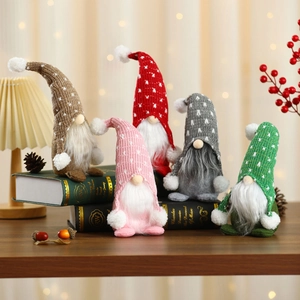 Set of five colorful Christmas plush gnomes with knitted hats for holiday home decoration