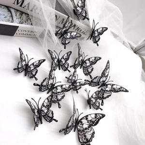 Set of 12 black and white 3D butterfly wall decals with skull patterns and rose motifs