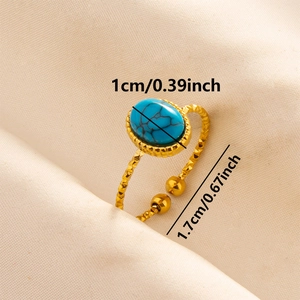 Detail view of gold boho ring featuring oval blue turquoise stone with size dimensions