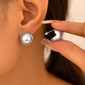 Polished silver sphere stud earrings in minimalist geometric style for women