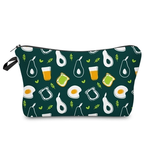 Detail view of avocado cartoon patterns on a waterproof green polyester makeup bag