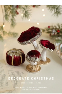 Detail of burgundy velvet Christmas mushroom and pumpkin ornaments with gold glitter accents