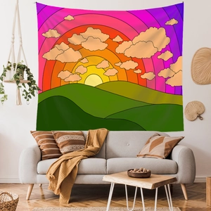 Vibrant cartoon sunset hills tapestry hanging above a modern grey sofa in a living room