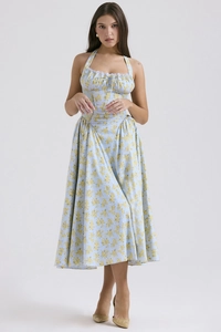 Detailed view of floral halter dress with white lace trim and light blue print