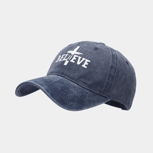 Detail of navy blue washed canvas baseball cap with white Believe embroidery and cross